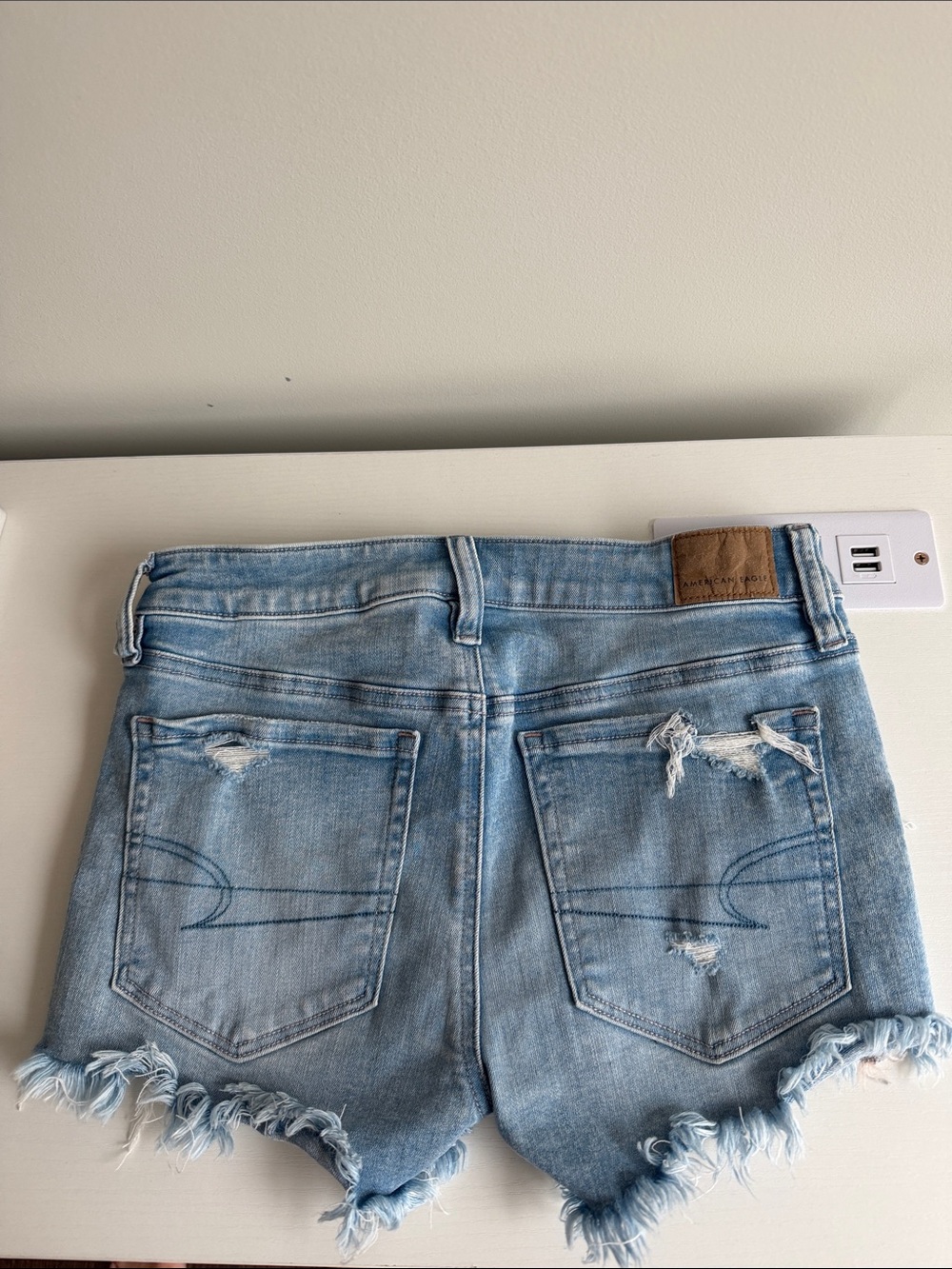 American Eagle Outfitters Light Wash Distressed Denim Cutoff Shorts - Picture 2 of 2